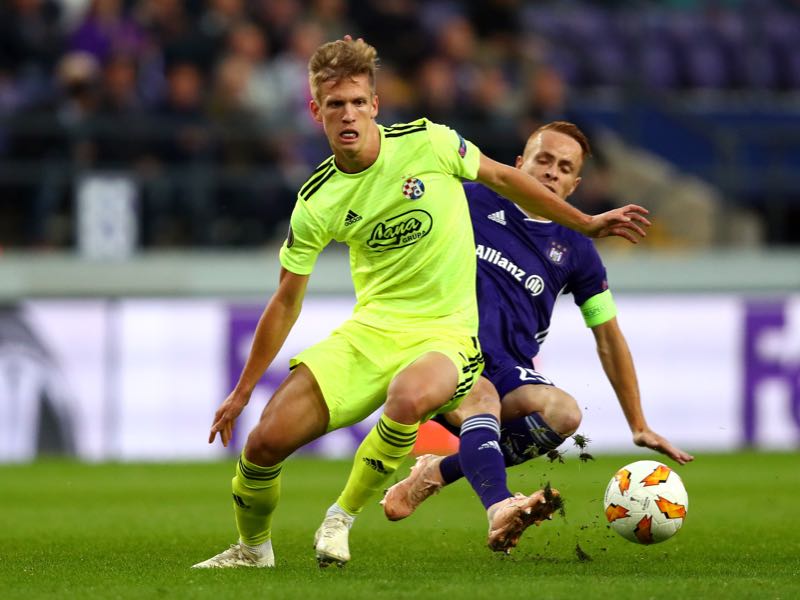 Adrien Trebel of RSC Anderlecht tackles Dani Olmo of Dinamo Zagreb during the UEFA Europa League Group D match between RSC Anderlecht and Dinamo Zagreb at Constant Vanden Stock Stadium on October 4, 2018 in Brussels, Belgium. (Photo by Dean Mouhtaropoulos/Getty Images)