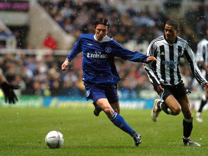 Chelsea's Smertin (l) and Newcastle's Kieron Dyer(r) fight for the ball during their FA Cup clash at St James' Park Newcastle 20 February 2005. AFP PHOTO PAUL BARKER (Photo credit should read PAUL BARKER/AFP/Getty Images)