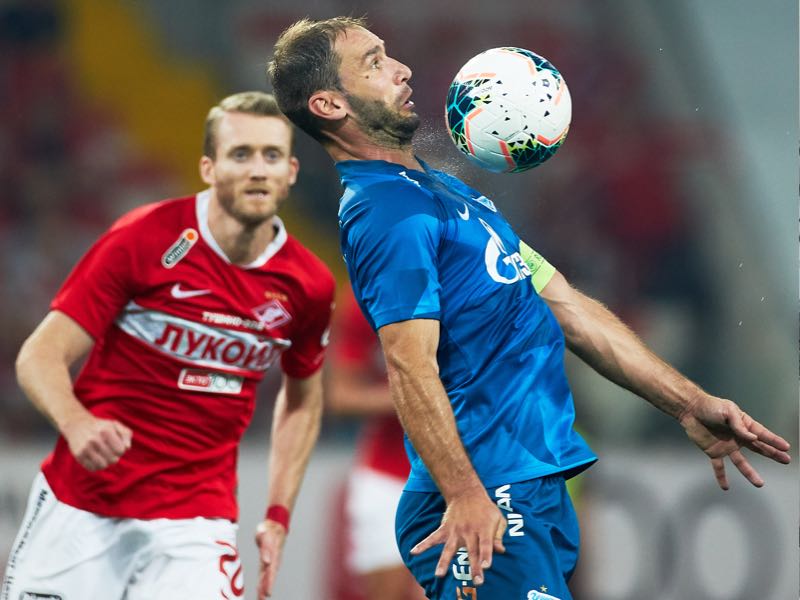 André Schürrle of FC Spartak Moscow and Branislav Ivanovic of FC Zenit Saint Petersburg vie for the ball during the Russian Football League match between FC Spartak Moscow and FC Zenit Saint Petersburg at Otkrytie Arena stadium on September 1, 2019 in Moscow, Russia. (Photo by Epsilon/Getty Images)