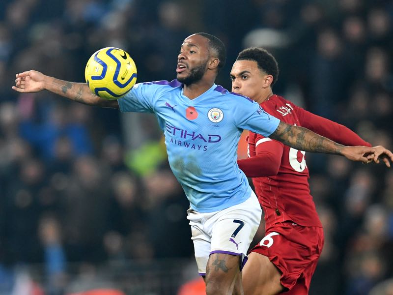 Manchester City's English midfielder Raheem Sterling (L) vies with Liverpool's English defender Trent Alexander-Arnold (R) during the English Premier League football match between Liverpool and Manchester City at Anfield in Liverpool, north west England on November 10, 2019. (Photo by Paul ELLIS / AFP) 