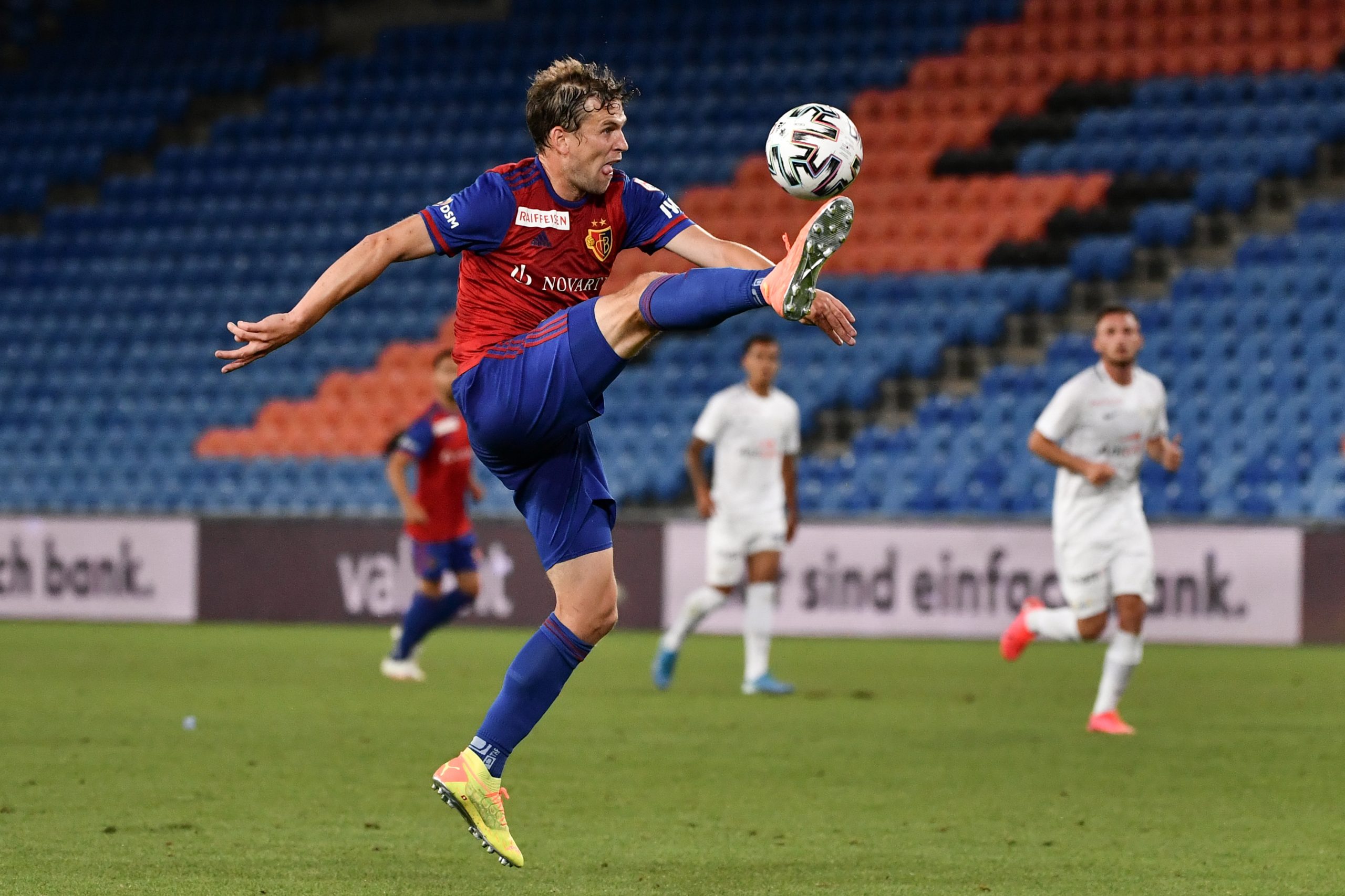 FC Basel's Swiss midfielder Fabian Frei controls the ball during the Swiss Super League football match between FC Basel and FC Zurich played with its U21 team as part of its first-team squad was placed under lockdown after six players and three staff members have been tested positive to the COVID-19, on July 14, 2020 in Basel. (Photo by Fabrice COFFRINI / AFP) (Photo by FABRICE COFFRINI/AFP via Getty Images)